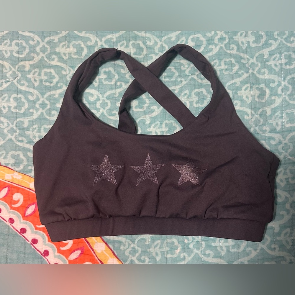 Strut This Black Star-Patterned Sports Bra